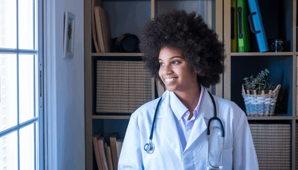 A young doctor looking out a window