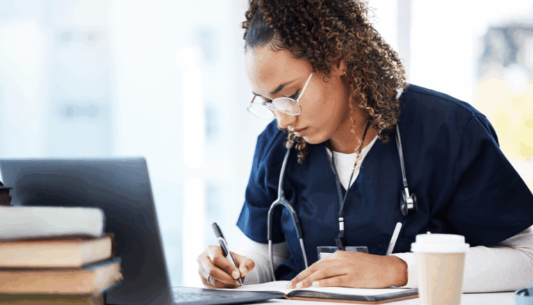 A young doctor or medical student writing in a notebook