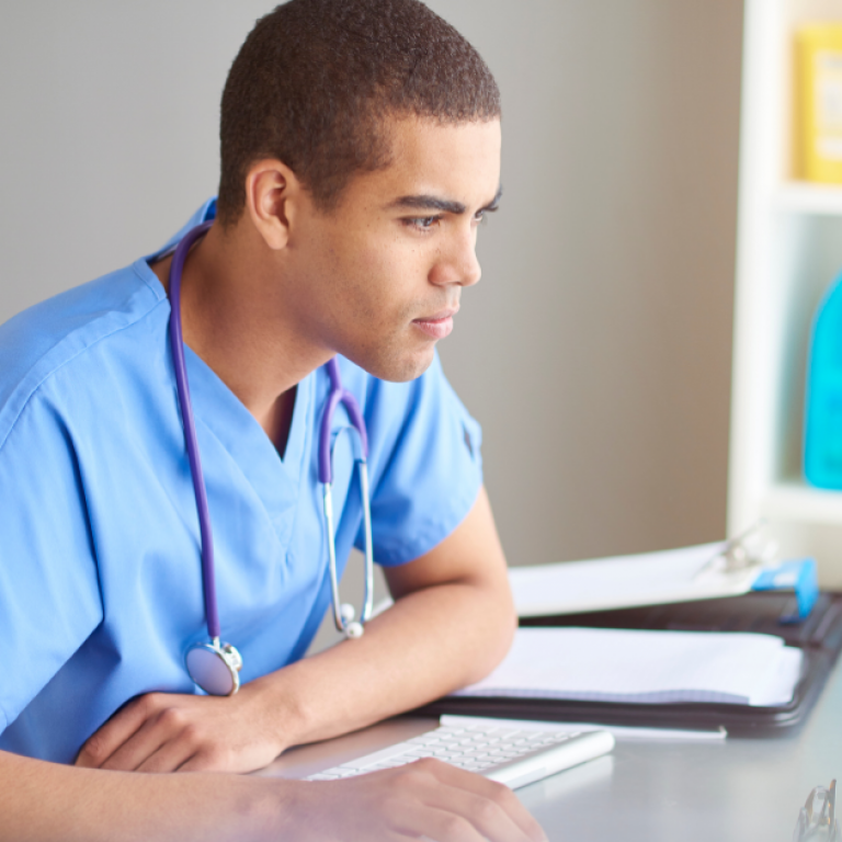 Income-driven repayment program refer. Doctor looking at computer