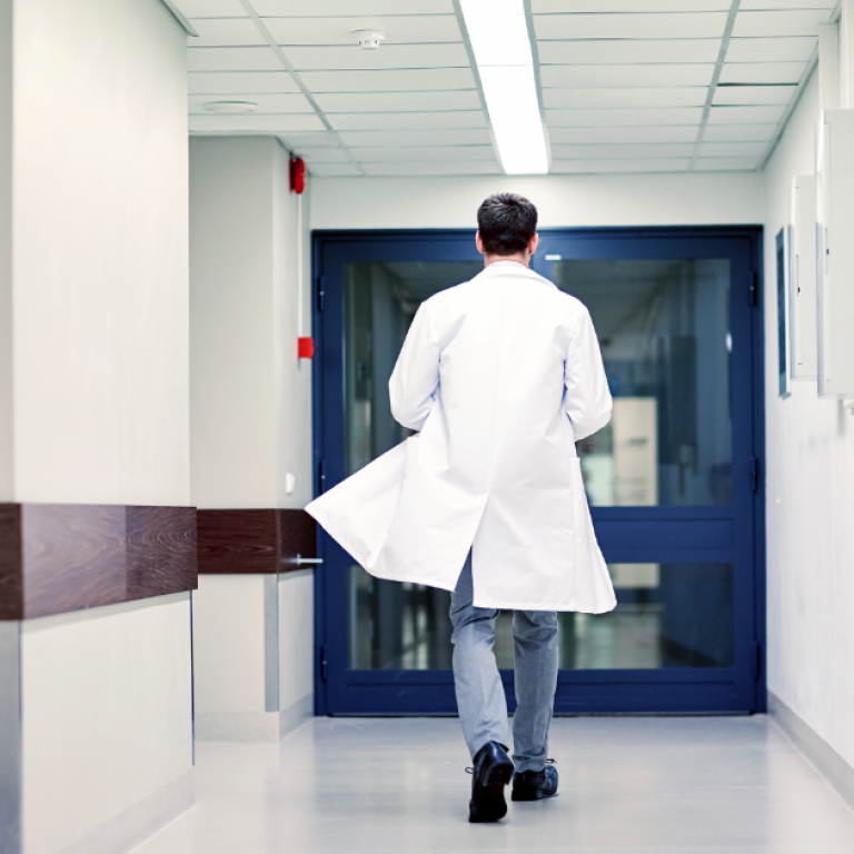 This is a picture of a doctor walking through a hospital to represent job changes for doctors.