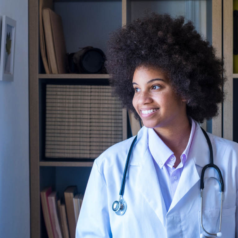 Beyond the Interview: How Doctors Can Maximize Site Visits Before Signing a Contract A young doctor looking out a window