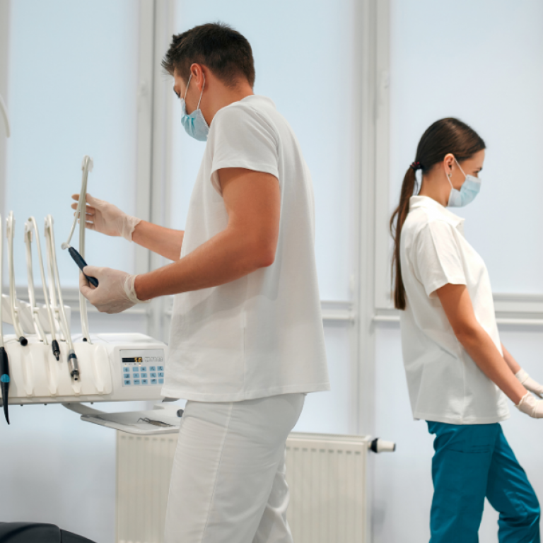 Two dental professionals in a dental office